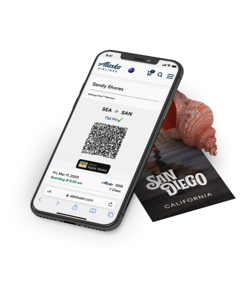 3D image of an iPhone displaying a boarding pass alongside a seashell and a San Diego, CA brochure.